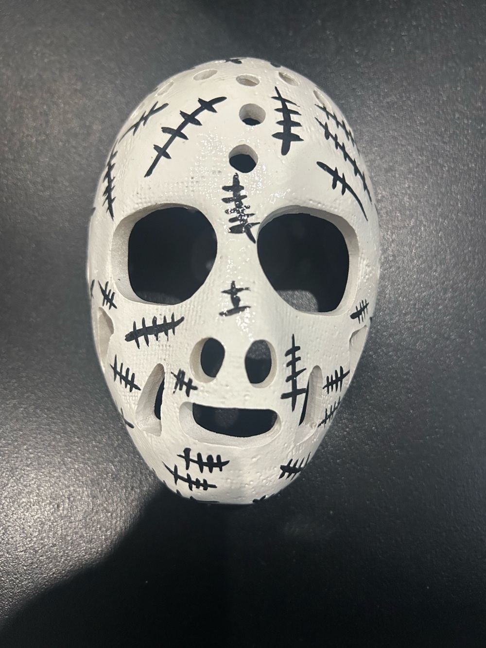 Gerry Cheevers’ hockey goalie mask for display.